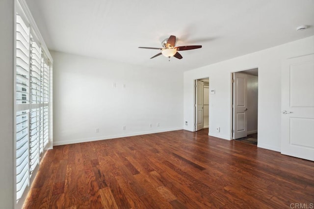 unfurnished bedroom with baseboards, a ceiling fan, and wood finished floors