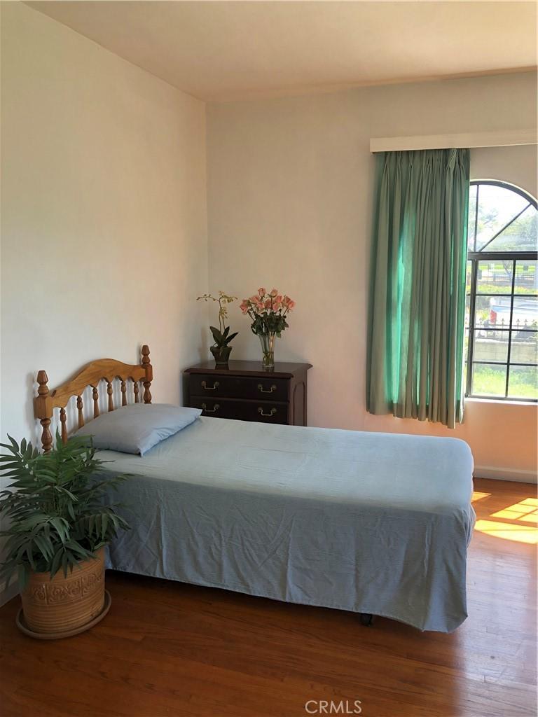bedroom featuring wood finished floors