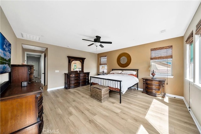 26165 Santiago Canyon Rd, Corona, CA 92883 - bedroom with light wood finished floors, baseboards, a ceiling fan, and visible vents