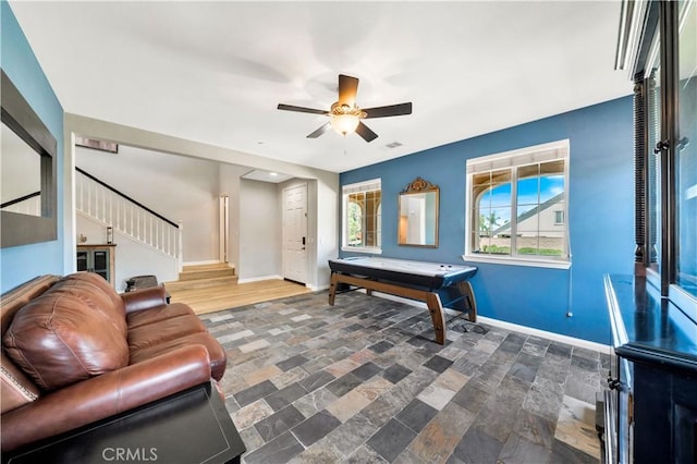 26165 Santiago Canyon Rd, Corona, CA 92883 - game room featuring visible vents, baseboards, a ceiling fan, and stone finish floor