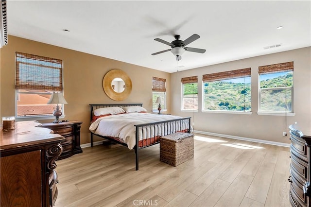 26165 Santiago Canyon Rd, Corona, CA 92883 - bedroom with a ceiling fan, baseboards, light wood-type flooring, and visible vents