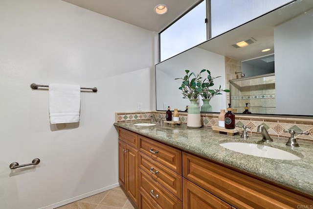 159 Mozart Ave, Cardiff By The Sea, CA 92007 - bathroom with double vanity, tiled shower, and tile patterned flooring