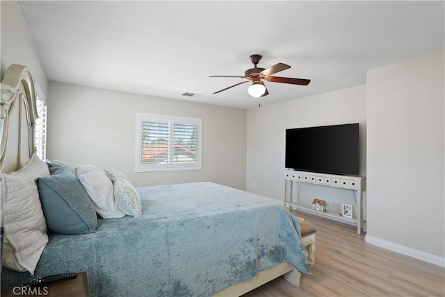 29851 Fox Creek Dr, Menifee, CA 92586 - bedroom featuring wood finished floors, baseboards, and a ceiling fan