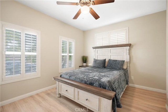29851 Fox Creek Dr, Menifee, CA 92586 - bedroom featuring baseboards, light wood-style flooring, and ceiling fan