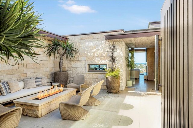 1231 Dolphin, Corona Del Mar, CA 92625 - view of patio with an outdoor fire pit