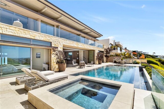 1231 Dolphin, Corona Del Mar, CA 92625 - view of swimming pool featuring an infinity pool, an in ground hot tub, and a patio