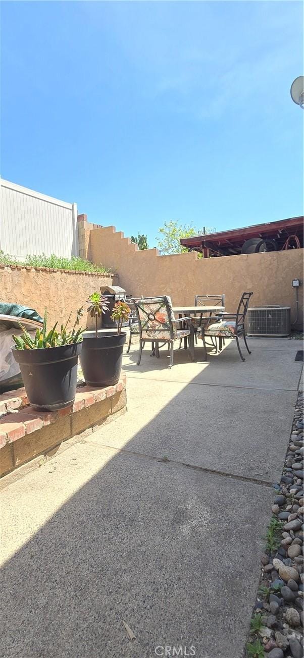 view of patio featuring cooling unit