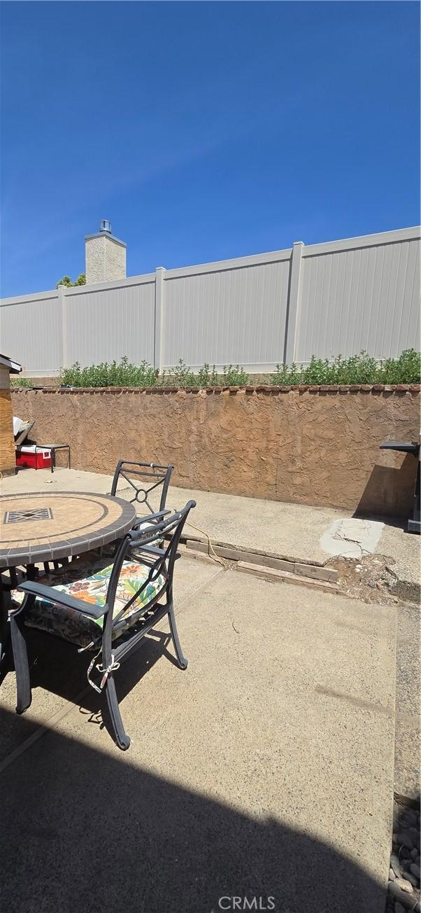 view of patio featuring fence