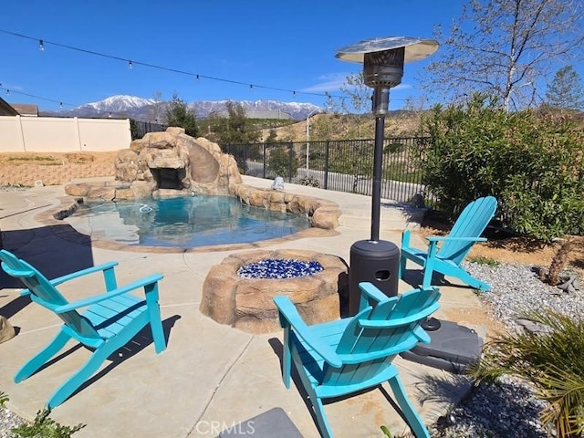 1445 Sandy Hill Dr, Calimesa, CA 92320 - view of pool with a mountain view, fence, a patio, and a fenced in pool