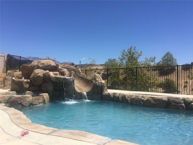 1445 Sandy Hill Dr, Calimesa, CA 92320 - view of swimming pool with a fenced in pool and fence