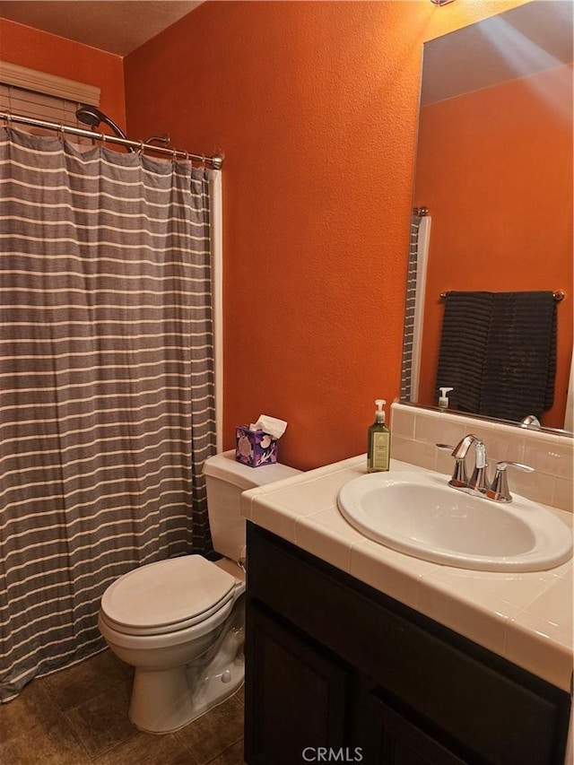 1445 Sandy Hill Dr, Calimesa, CA 92320 - full bath featuring a textured wall, vanity, a shower with shower curtain, and toilet