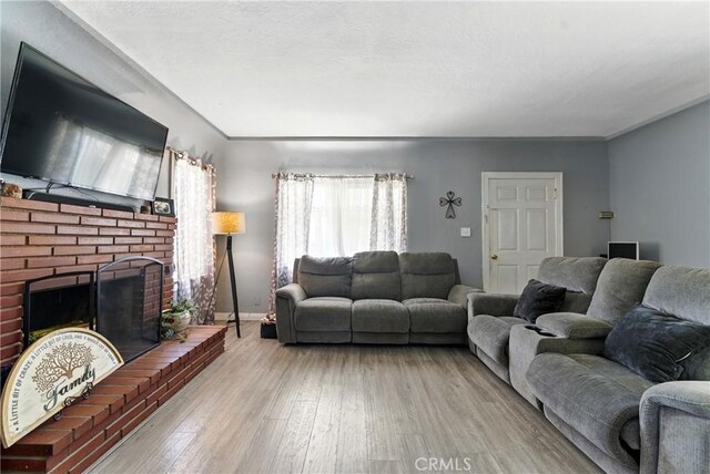 2965 Poplar Dr, Lynwood, CA 90262 - living area with a fireplace and wood finished floors