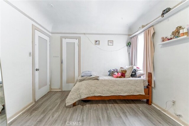2965 Poplar Dr, Lynwood, CA 90262 - bedroom with light wood-type flooring and baseboards