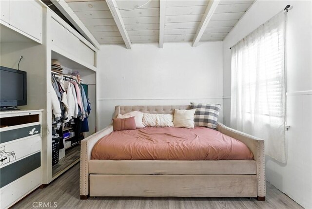 2965 Poplar Dr, Lynwood, CA 90262 - bedroom with light wood-style floors, a closet, and a wood ceiling with exposed beams