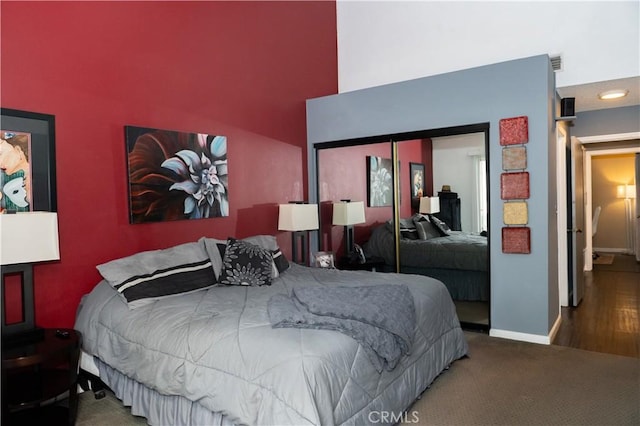 1725 Truman Cir, Placentia, CA 92870 - carpeted bedroom featuring a closet, a towering ceiling, and baseboards