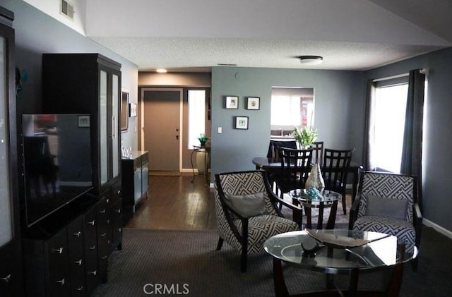 1725 Truman Cir, Placentia, CA 92870 - living room with dark wood finished floors, baseboards, and a textured ceiling