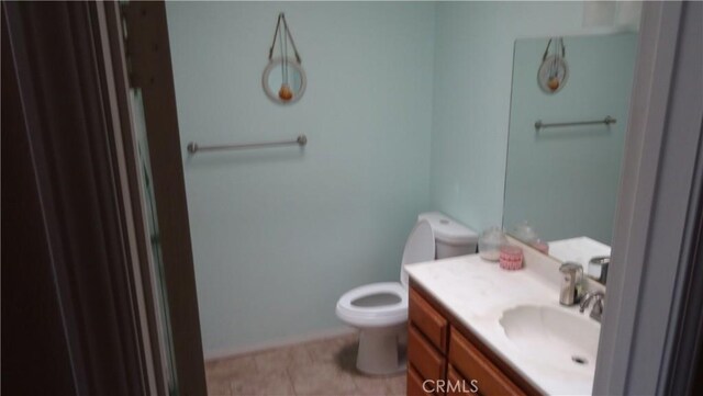 6301 Park Ave, Lake Isabella, CA 93240 - bathroom with baseboards, toilet, tile patterned flooring, and vanity