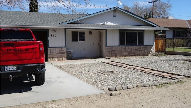 6301 Park Ave, Lake Isabella, CA 93240 - single story home featuring fence, a shingled roof, and stone siding
