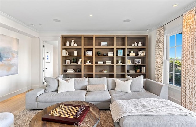 living area with baseboards, recessed lighting, wood finished floors, and ornamental molding