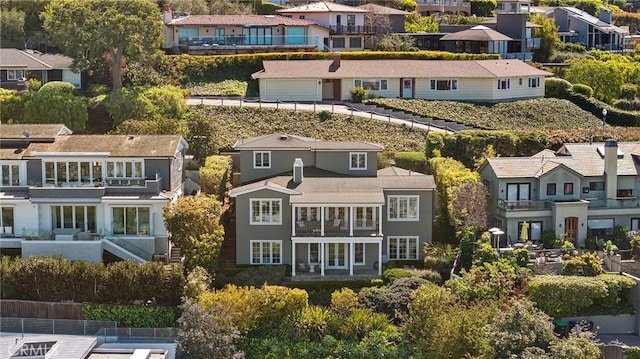 birds eye view of property with a residential view