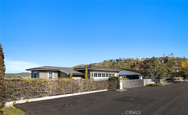 view of front of home featuring fence