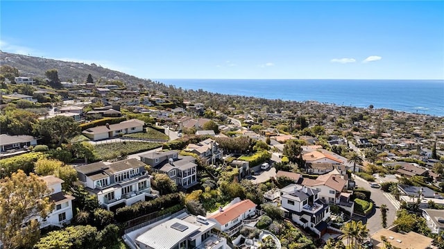 drone / aerial view featuring a residential view and a water view