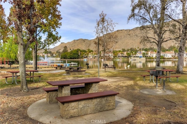 view of home's community with a water and mountain view
