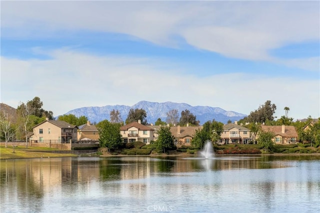 water view featuring a residential view and a mountain view