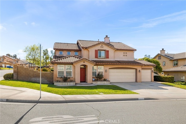 mediterranean / spanish-style home featuring a tile roof, stucco siding, driveway, a front lawn, and a chimney