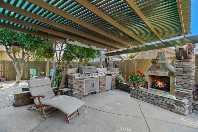 4365 Alta Vista Dr, Riverside, CA 92506 - fenced backyard featuring an outdoor stone fireplace and a patio area
