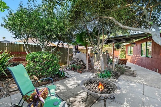 4365 Alta Vista Dr, Riverside, CA 92506 - fenced backyard featuring a fire pit and a patio