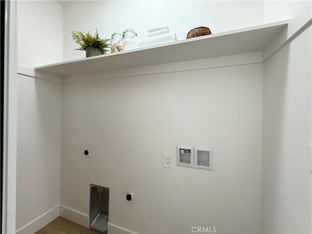 washroom featuring hookup for an electric dryer, laundry area, wood finished floors, baseboards, and hookup for a washing machine