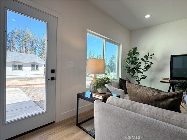 entryway with recessed lighting, baseboards, and light wood finished floors