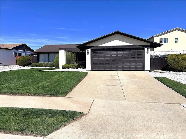 4971 W Gilman St, Banning, CA 92220 - ranch-style house featuring a garage, concrete driveway, and stucco siding