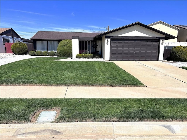 4971 W Gilman St, Banning, CA 92220 - ranch-style house with a garage, a front lawn, stucco siding, and driveway
