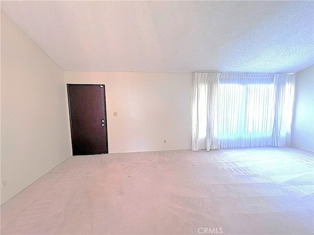 4971 W Gilman St, Banning, CA 92220 - carpeted spare room with a textured ceiling