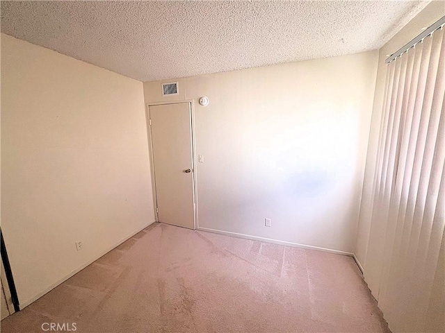 4971 W Gilman St, Banning, CA 92220 - empty room with light carpet and a textured ceiling