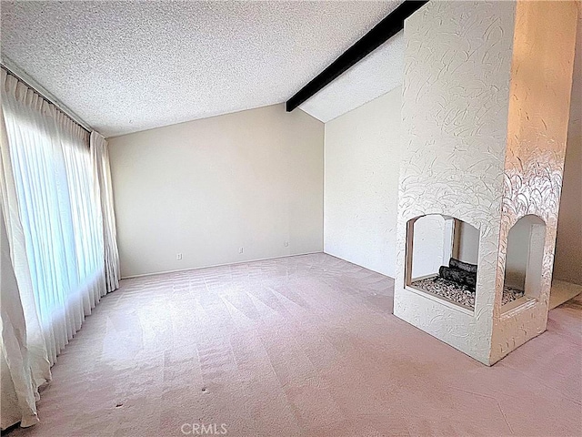 4971 W Gilman St, Banning, CA 92220 - unfurnished living room featuring carpet, a textured ceiling, and a multi sided fireplace