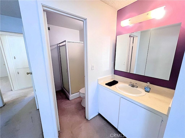 4971 W Gilman St, Banning, CA 92220 - full bath featuring a stall shower, toilet, and vanity