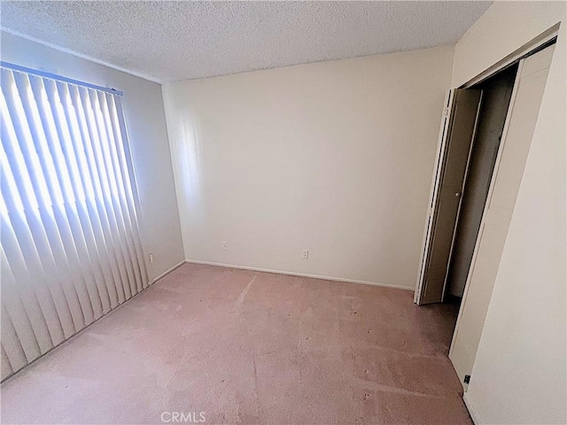 4971 W Gilman St, Banning, CA 92220 - unfurnished room with carpet, a textured ceiling, and baseboards