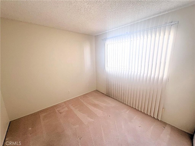 4971 W Gilman St, Banning, CA 92220 - unfurnished room featuring light colored carpet and a textured ceiling