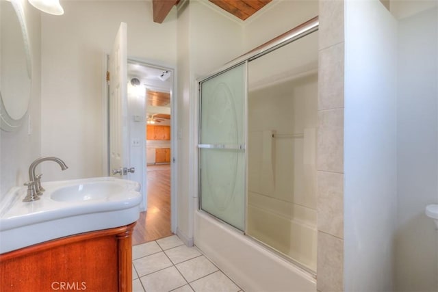 bathroom with tile patterned floors, vanity, and combined bath / shower with glass door