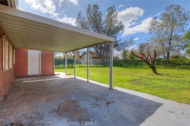 view of patio featuring a fenced backyard and an attached carport