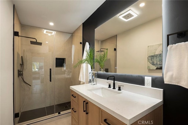 full bath with tile patterned floors, recessed lighting, vanity, and a stall shower