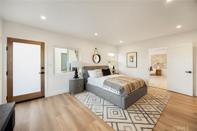 bedroom featuring recessed lighting and wood finished floors