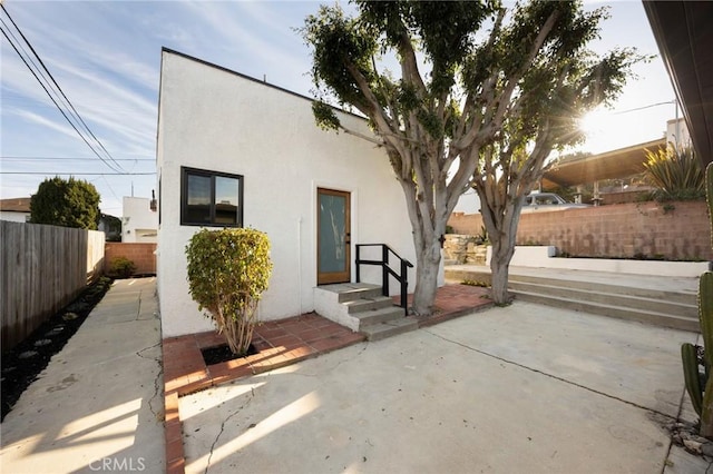 1331 W 17th St, San Pedro, CA 90732 - rear view of house featuring stucco siding, a patio area, and a fenced backyard