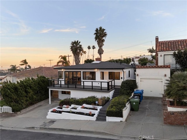 1331 W 17th St, San Pedro, CA 90732 - view of front of property featuring concrete driveway, a garage, and stucco siding