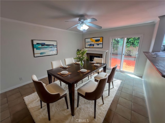 901 Vista Verde Cir, Duarte, CA 91010 - dining room with tile patterned flooring, crown molding, a ceiling fan, baseboards, and a tiled fireplace