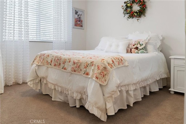 bedroom featuring carpet
