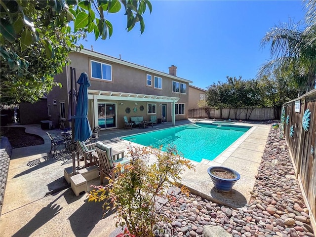 view of swimming pool featuring a fenced backyard, a pergola, a patio, and a fenced in pool